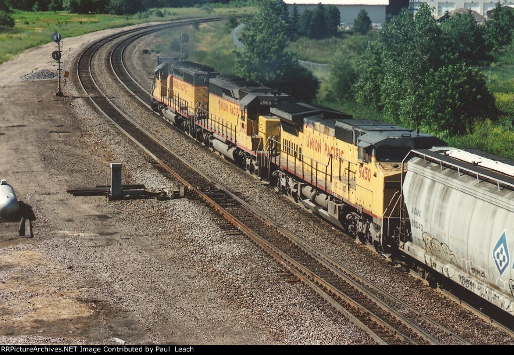 Westbound grain train eases uphill